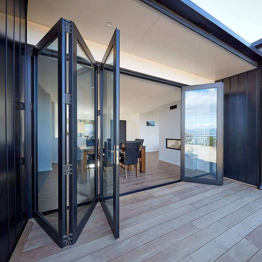 30 foot wide bi-fold panoramic folding glass doors open to modern interior design and outdoor space.