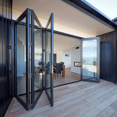 30 foot wide bi-fold panoramic folding glass doors open to modern interior design and outdoor space.