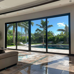 26 Foot Wide Aluminum Sliding 4-Panel Panoramic Patio Door Thermal (Multiple Heights) with view of pool and palm trees.