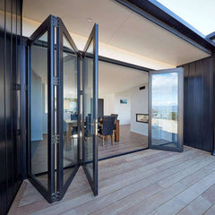 14-foot wide bi-fold panoramic glass door opening to a modern room with outdoor views, showcasing sleek design and functionality.