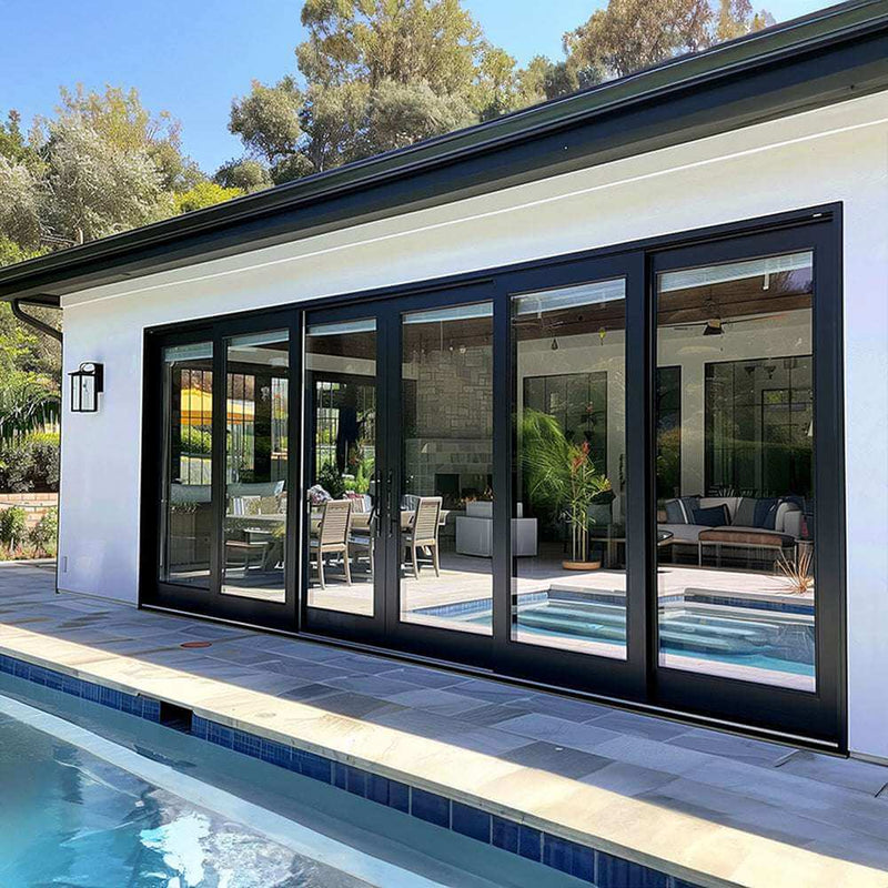 Heavy-duty 18-foot wide bi-fold panoramic door showcasing sleek aesthetics by the poolside.