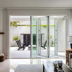Stylish bi-fold panoramic glass doors opening to a modern patio space for seamless indoor-outdoor living.