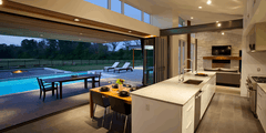 96" Wide BI-Fold Folding Door -Title 24 & NFRC Approved installed in modern kitchen with pool view.
